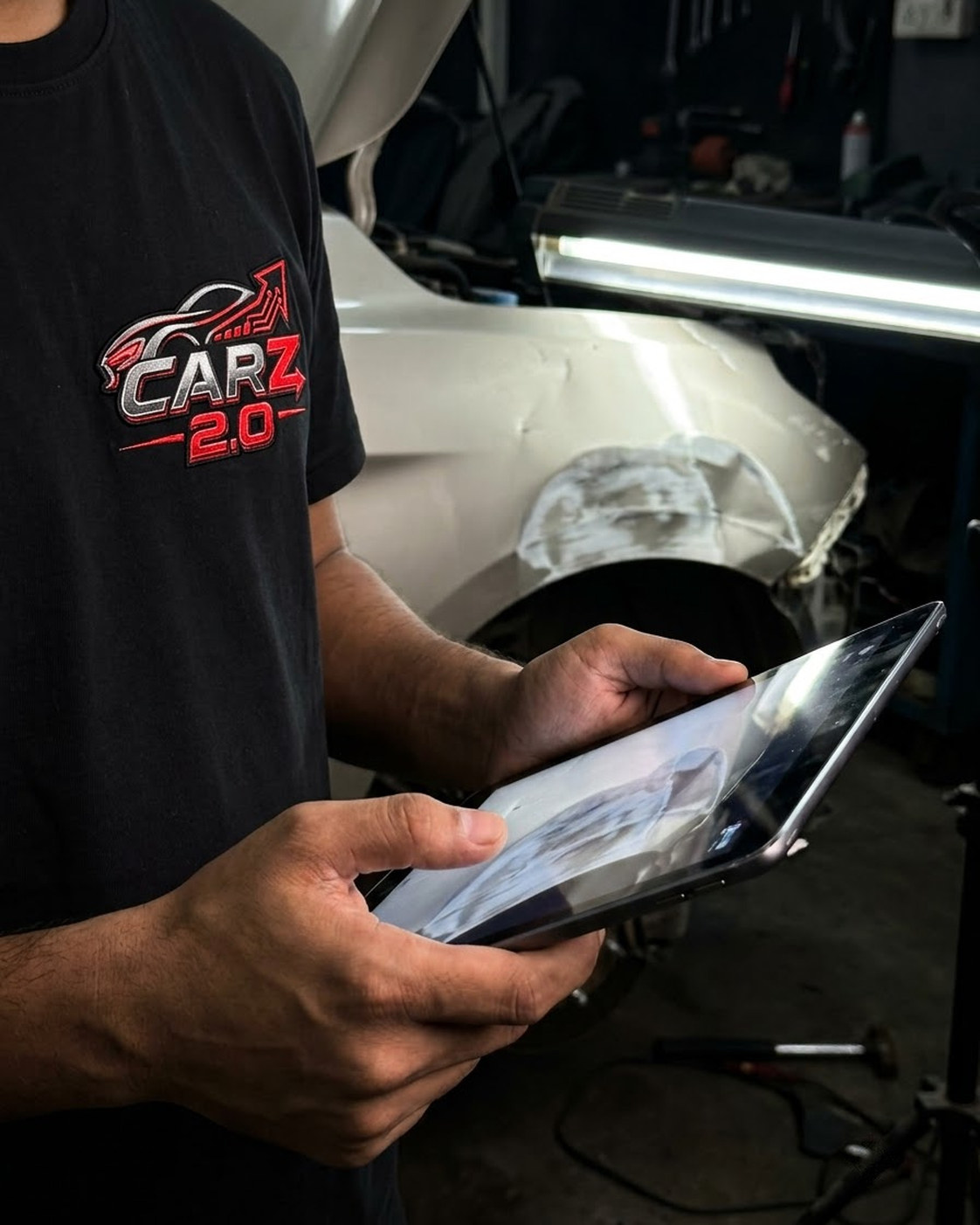 Automotive assessor documenting repairable accident damage